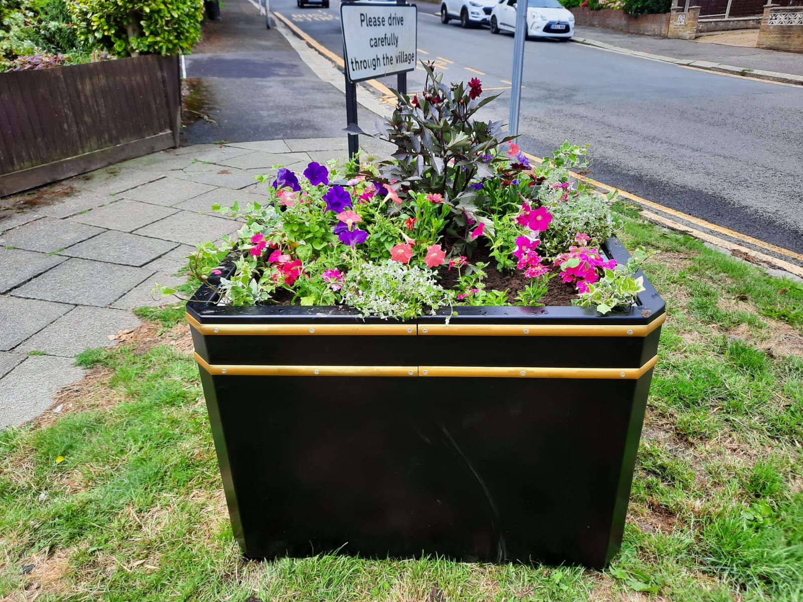 River Blooms: Community Spirit Lights Up the Village with New Planters